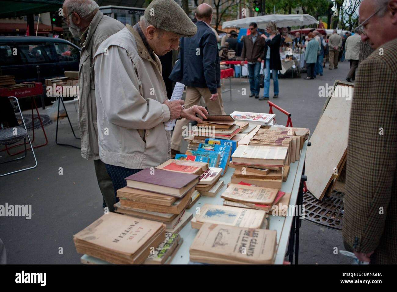 Adults Shopping In Public Flea Market Garage Sale On Street
