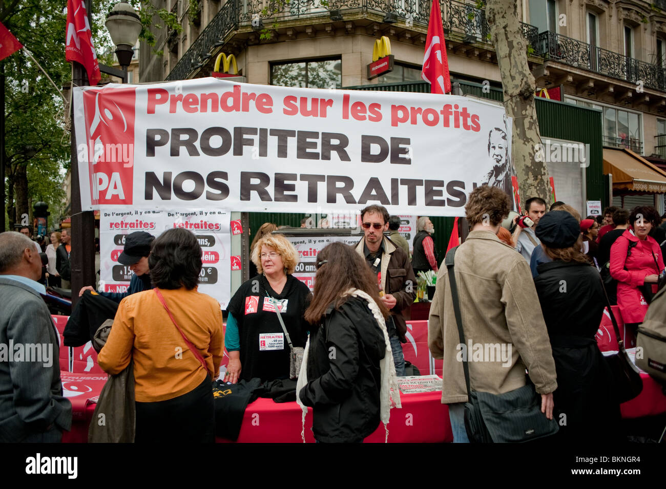 Adults Militants Protesting for Retirement Rights, National protests against government plans to overhaul the pension system , Paris Protest Signs on Street (NPA) capitalism protest, workers rights protests Stock Photo