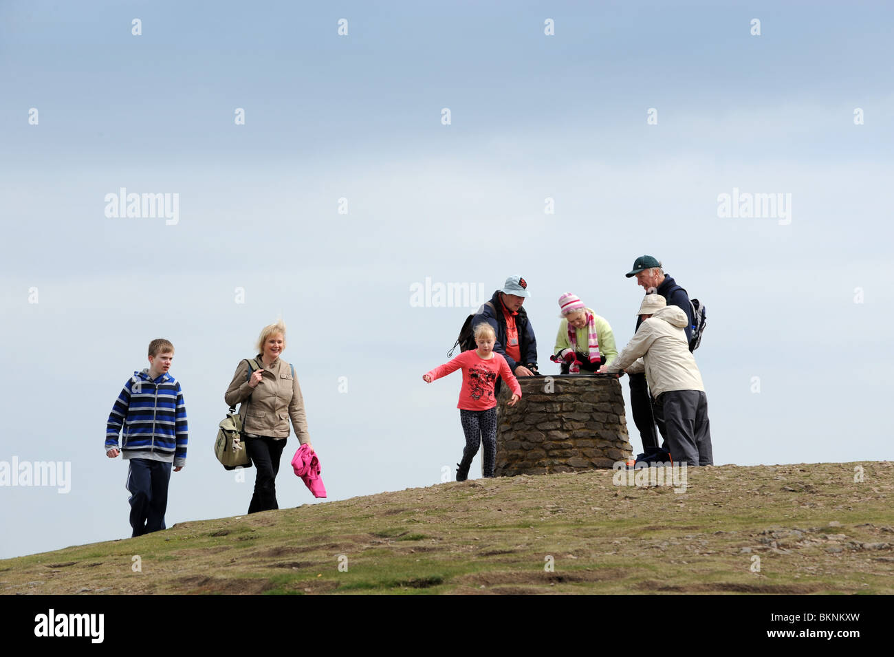 Walkers at the summit of the Wrekin Hill in Shropshire England Uk Stock Photo