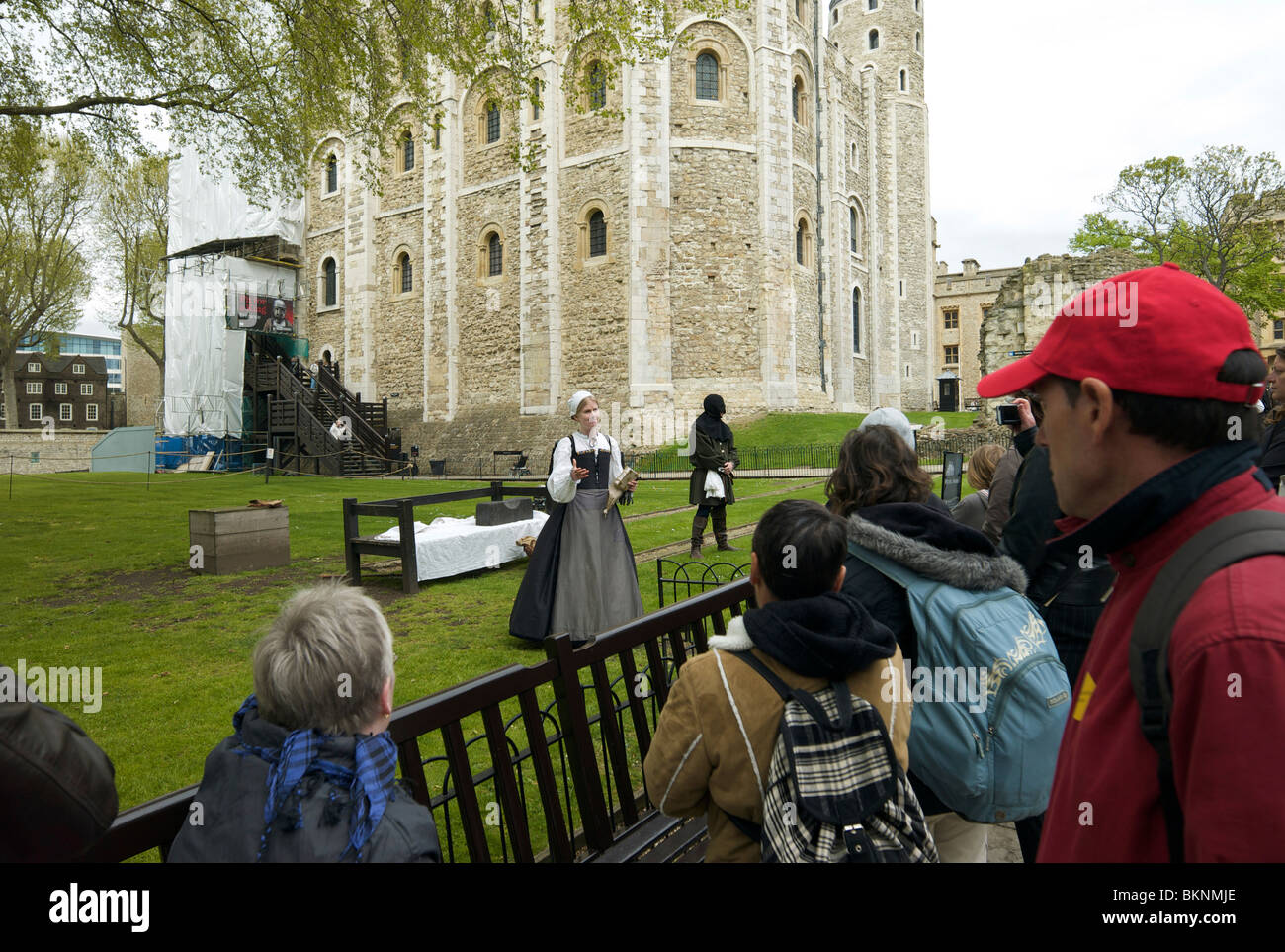 Actors tell the story of Lady Jane Grey to tourists at the Tower of London Stock Photo