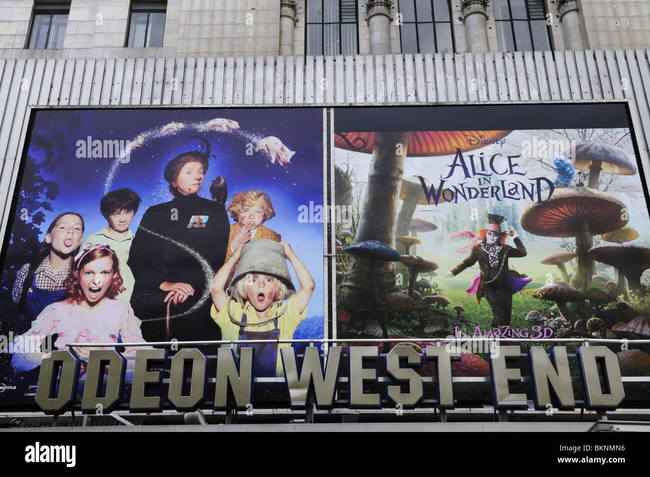 Odeon West End cinema sign with Alice in Wonderland Billboard, Leicester Square, London, England, UK Stock Photo