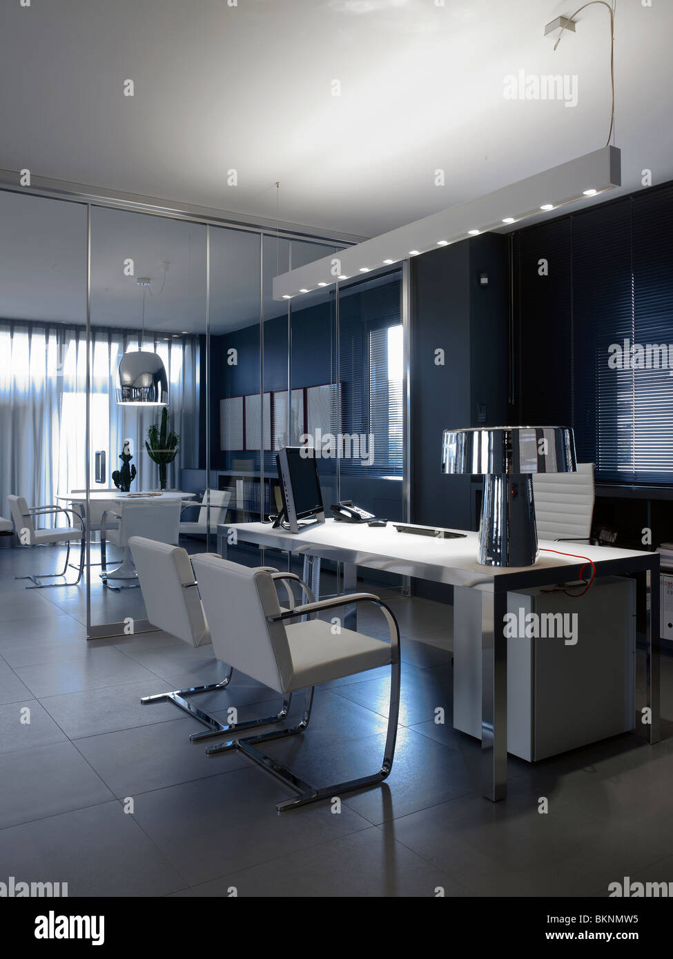 Office environment with tables, desks, chairs and computers Stock Photo ...
