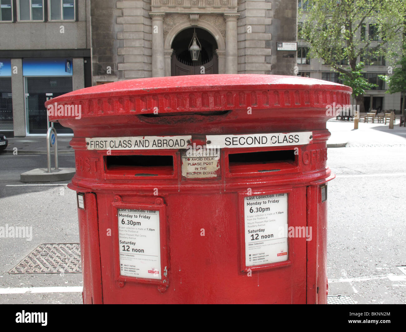 Royal Mail Red post box First class postage London UK Stock Photo