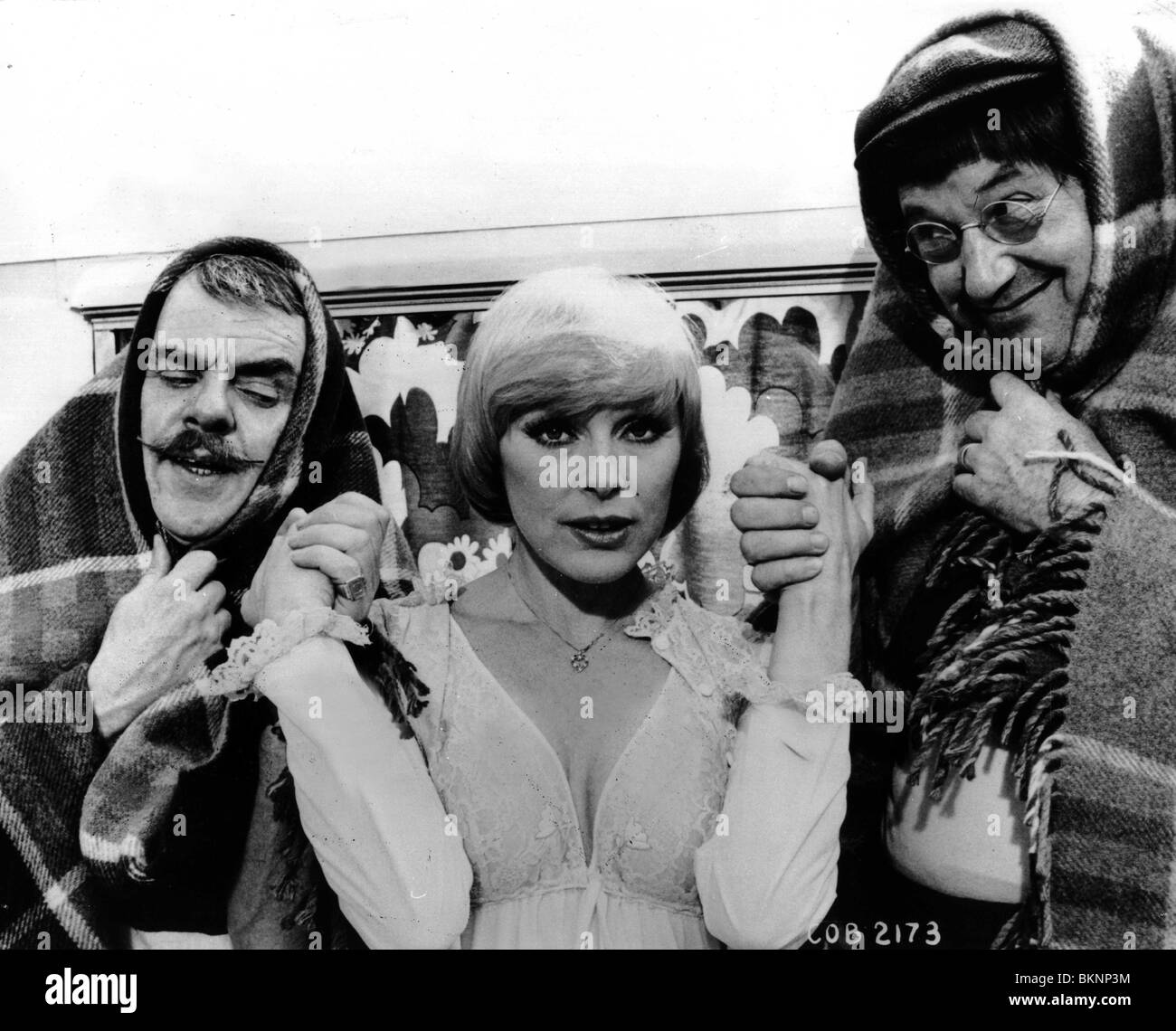 CARRY ON BEHIND (1975) WINDSOR DAVIES, ELKIE SOMMER, JACK DOUGLAS COBH 001P Stock Photo