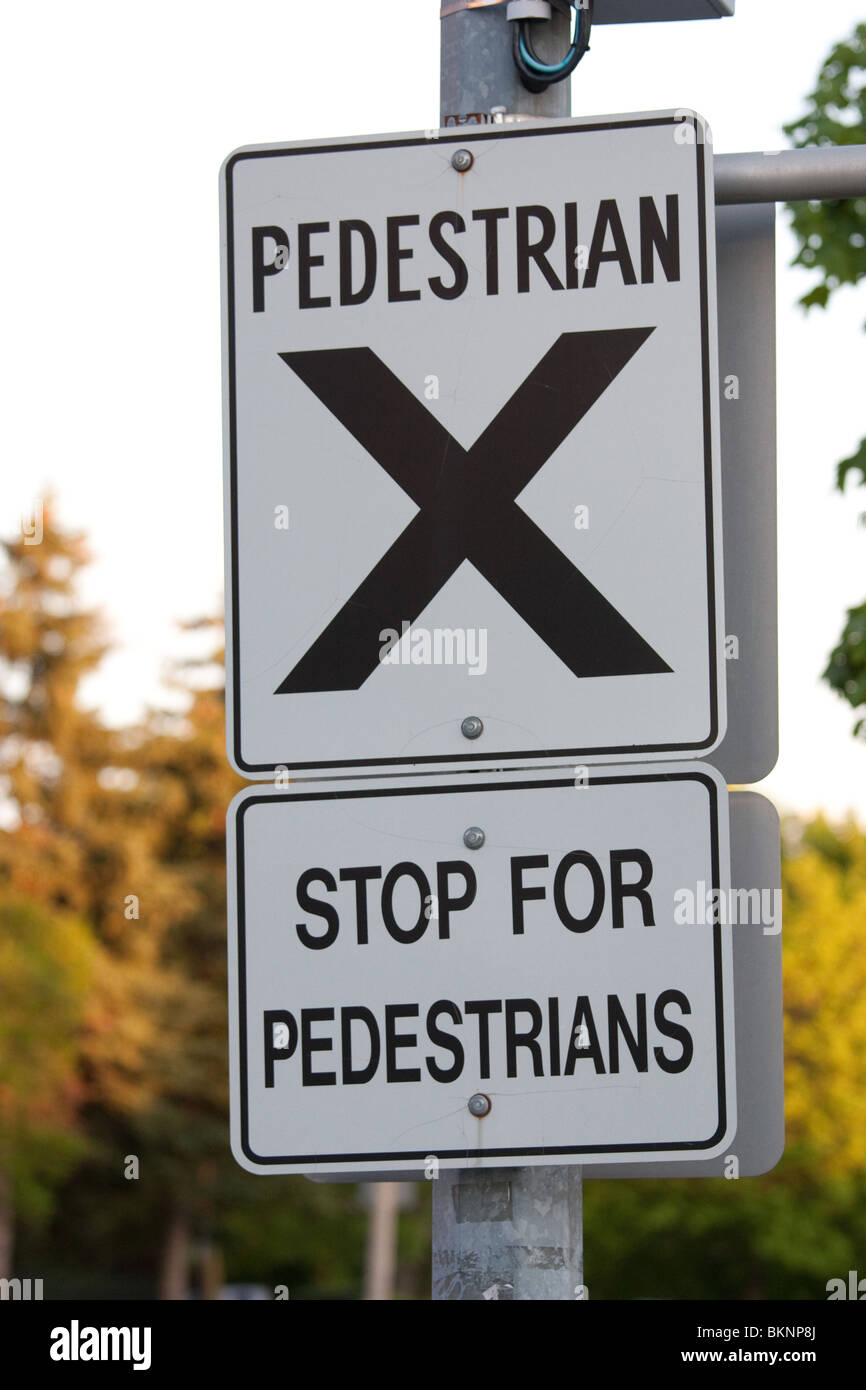 pedestrian walkway sign safe crossing cross Stock Photo