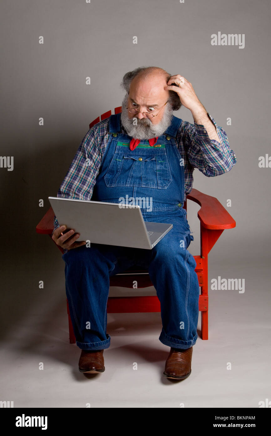 One man working on a laptop computer Stock Photo