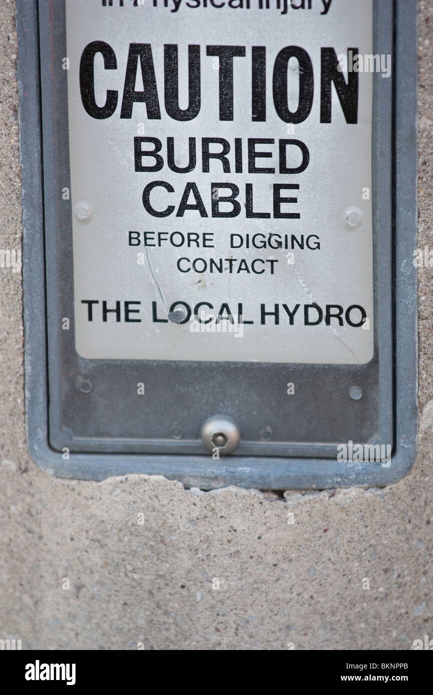 caution buried cable hydro danger warning Stock Photo