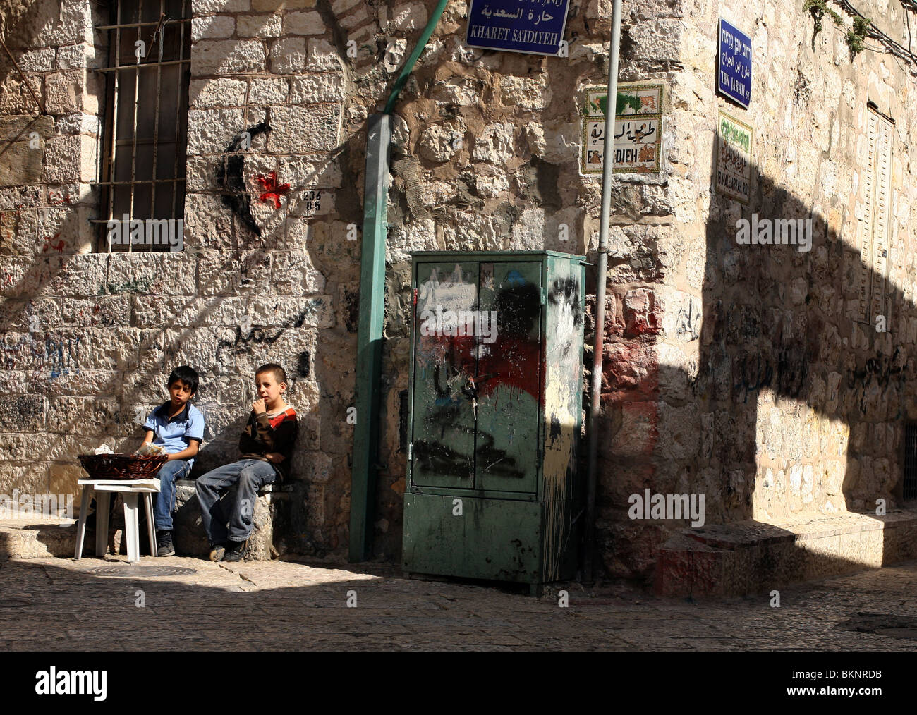 Two young boys are pictured selling popcorn in the Muslim Quarter of the Old City of Jerusalem in Israel. Stock Photo