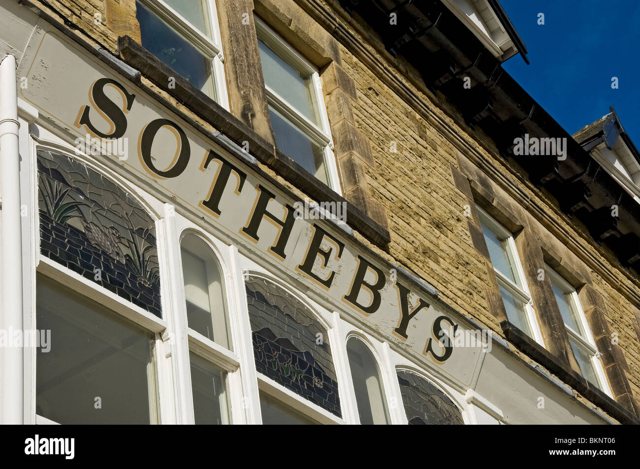 Close up of sign above the former Sotheby's auctioneer shop in Harrogate North Yorkshire England UK United Kingdom GB Great Britain Stock Photo