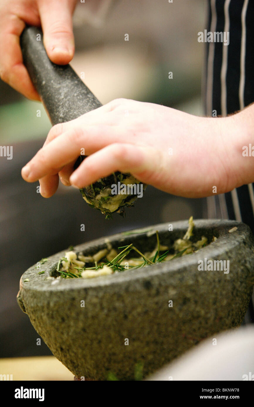 Food preparation in a restaurant kitchen pestle & mortar Stock Photo