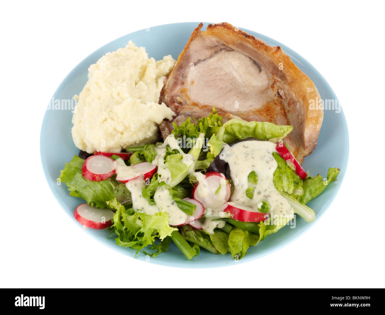 Grilled Pork Chop with Mashed Cauliflower and Salad Stock Photo