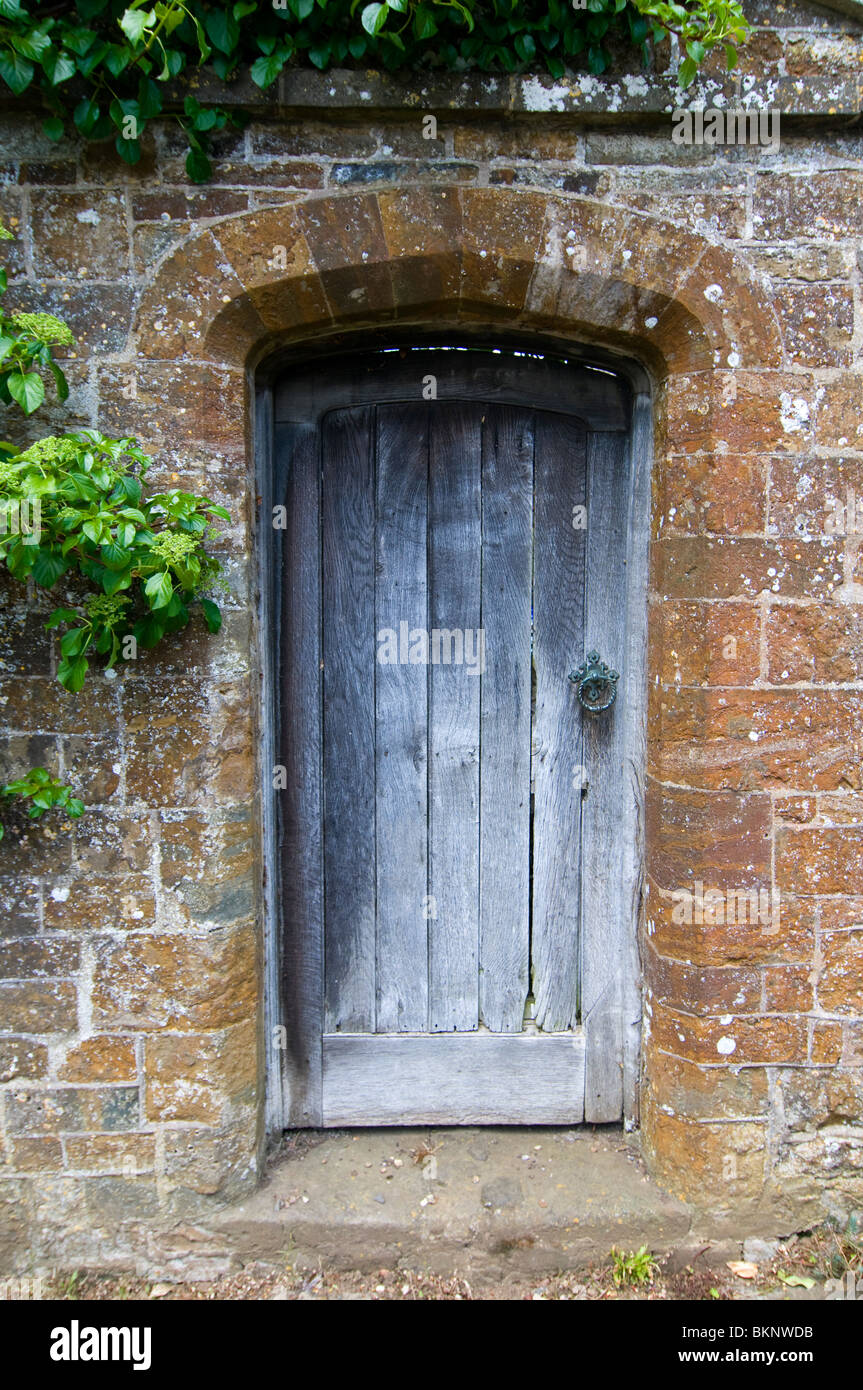 A door in an old stone wall Stock Photo - Alamy