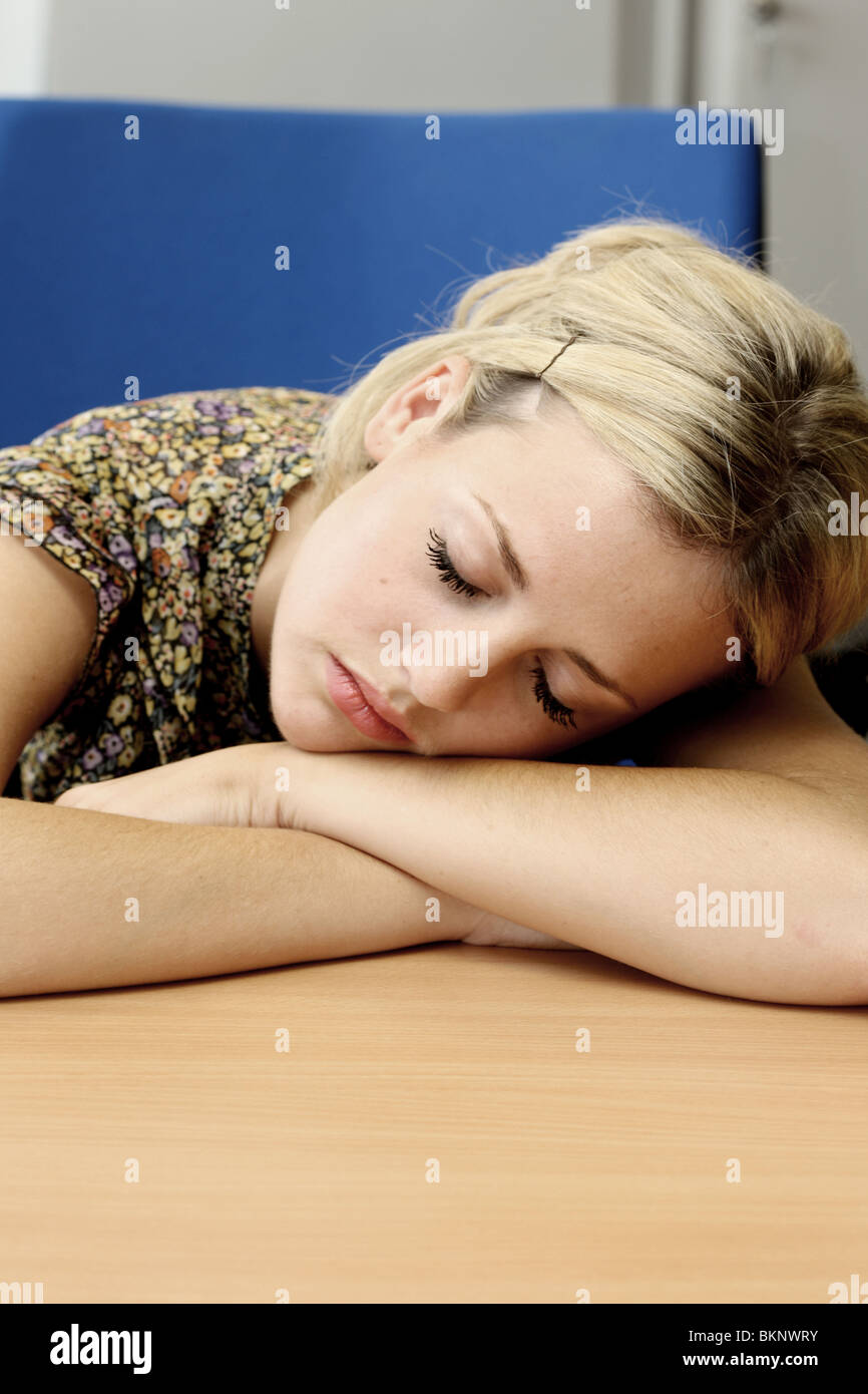 Young Business Woman At Work Tired And Fed Up loosing Interest In A Boring No Future Job Stock Photo