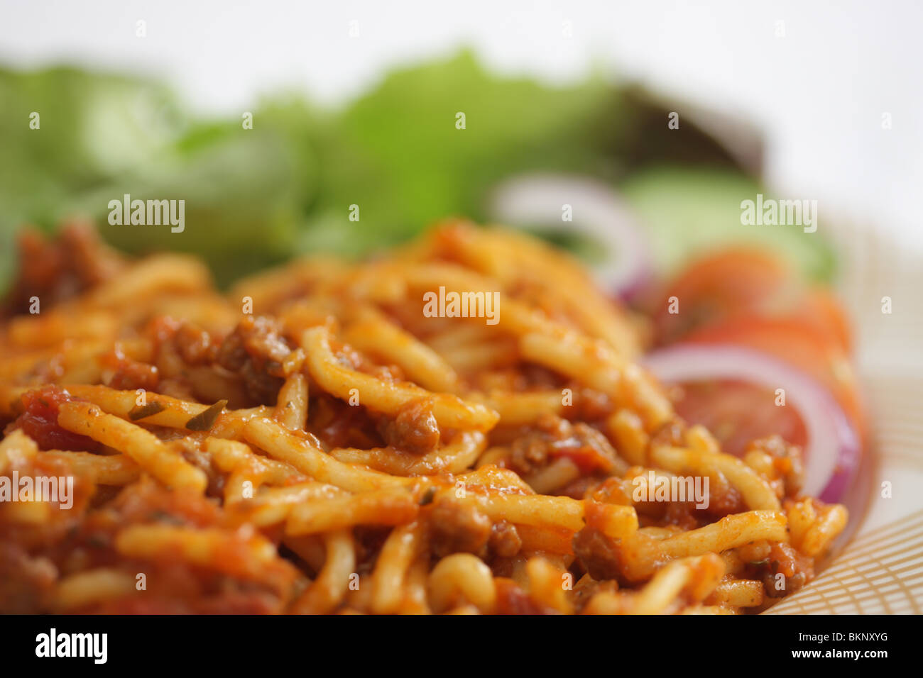 Authentic Italian Style Fresh Spaghetti Bolognese With Salad And No People Stock Photo