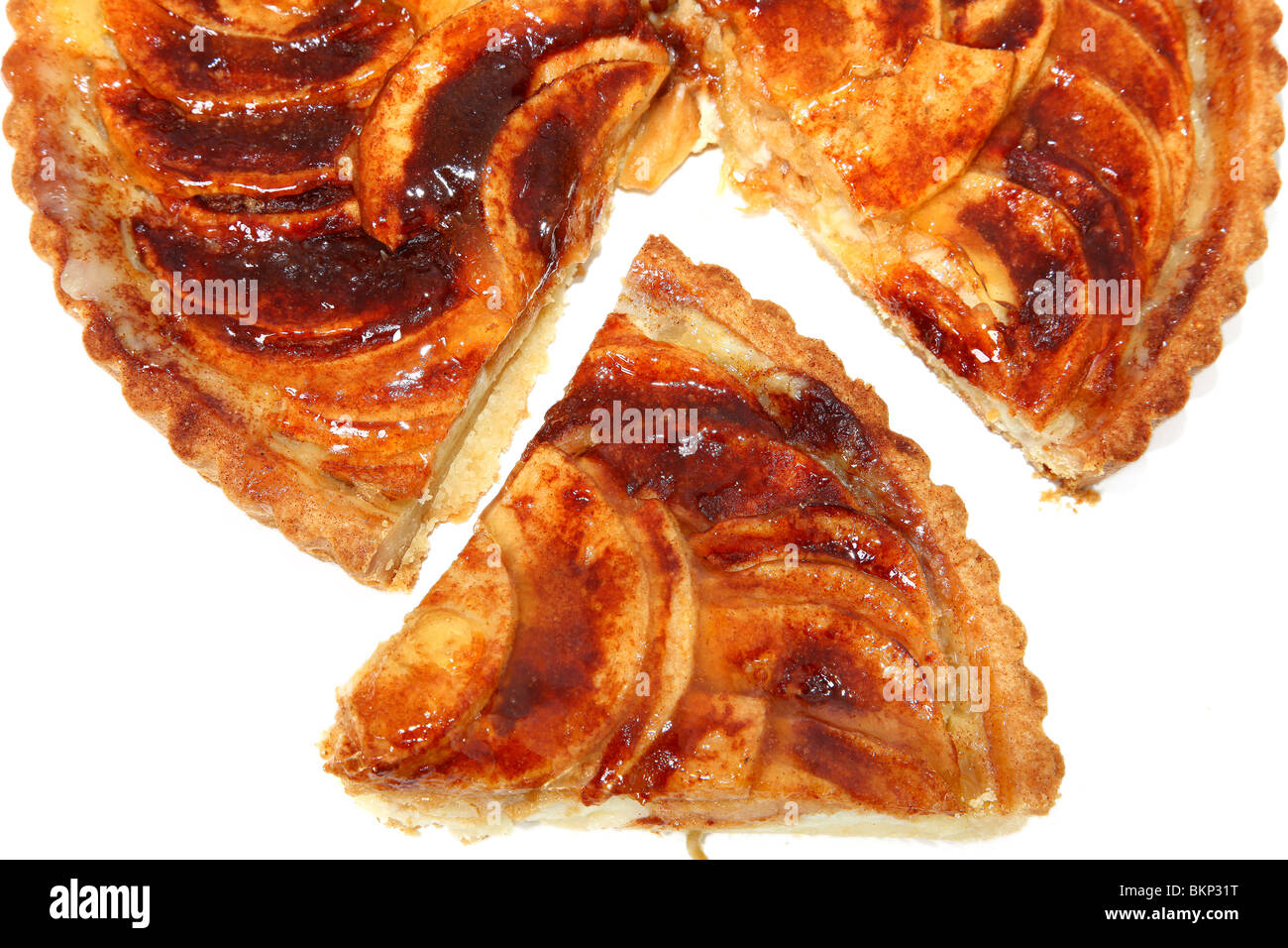 Large apple tart filled with custard over white background. Stock Photo