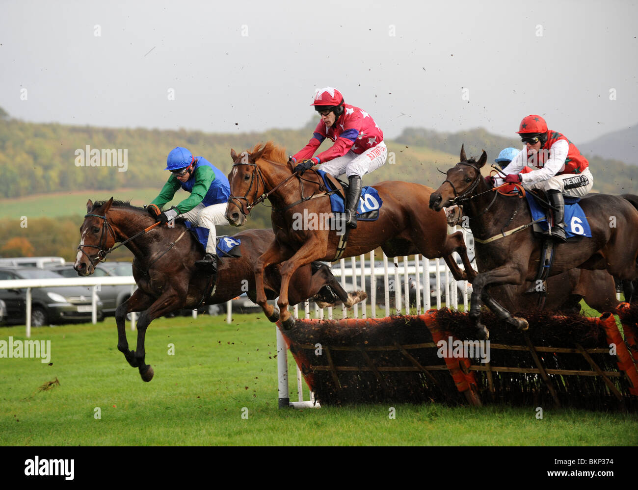 Horse racing over hurdles at Ludlow Race Course in Shropshire Uk Stock Photo