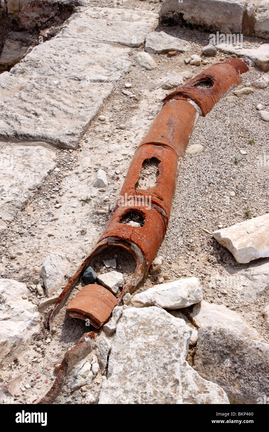 EXPOSED PIPEWORK WITHIN THE RUINS OF KOURION AT EPISKOPI ON THE ISLAND OF CYPRUS. Stock Photo