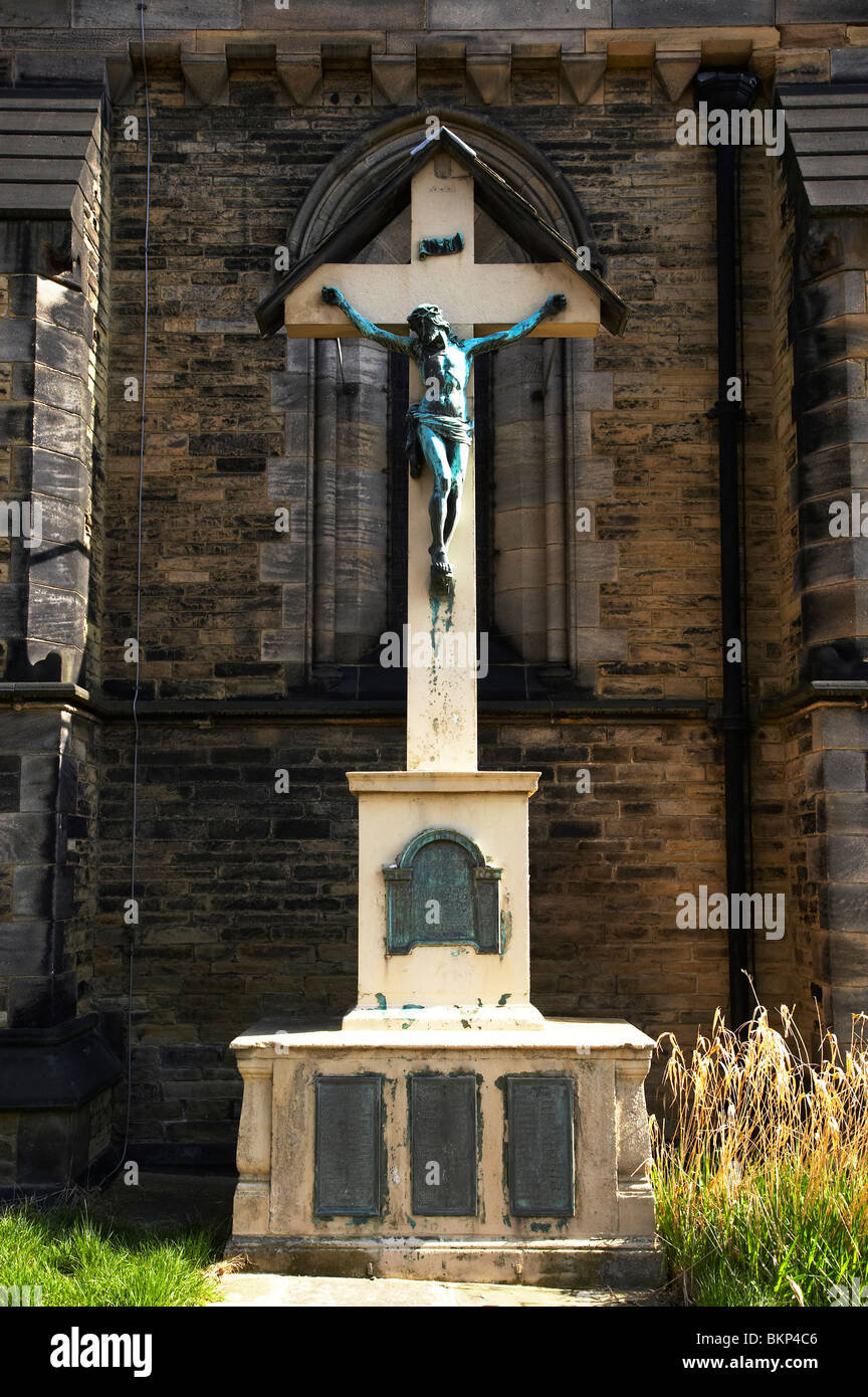 Statue of Jesus Christ on cross outside a Church in Leeds UK Stock Photo