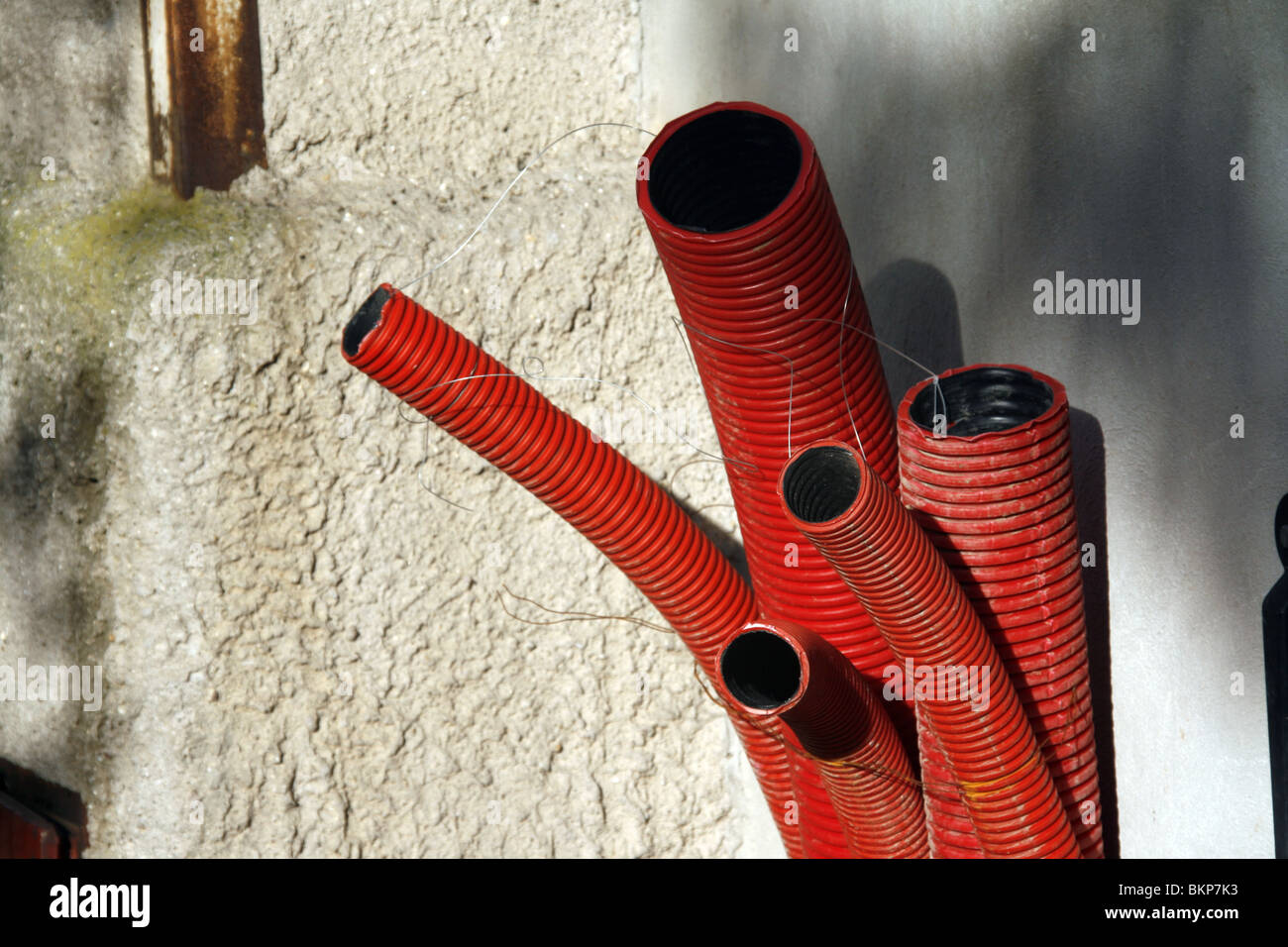 red plastic tubes on building site Stock Photo Alamy