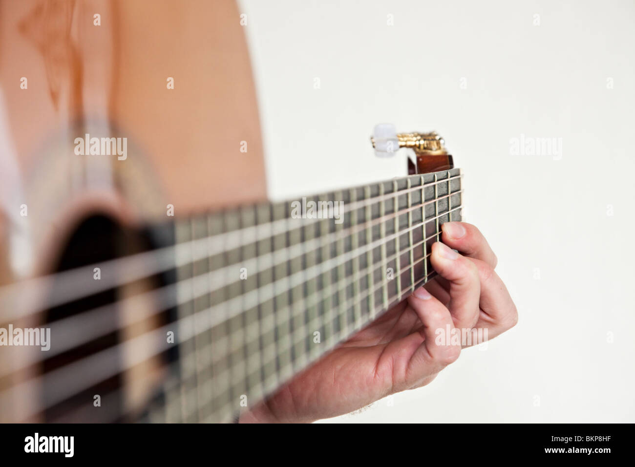 Nylon string classical guitar close up with left hand fingering the chord D  Stock Photo - Alamy