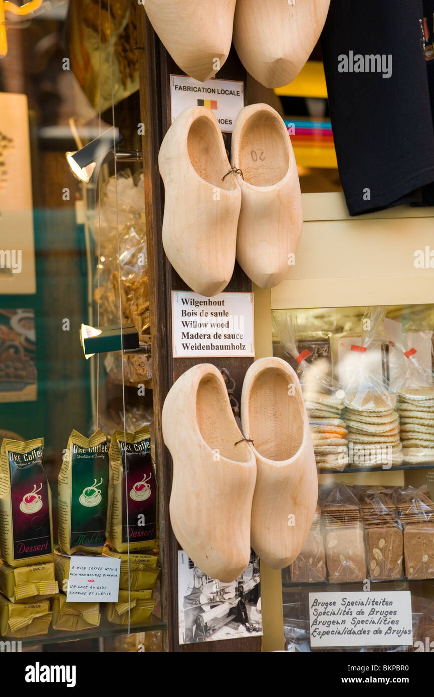 Traditional wooden shoes hanging on a wall outside a shop in Bruges Stock Photo
