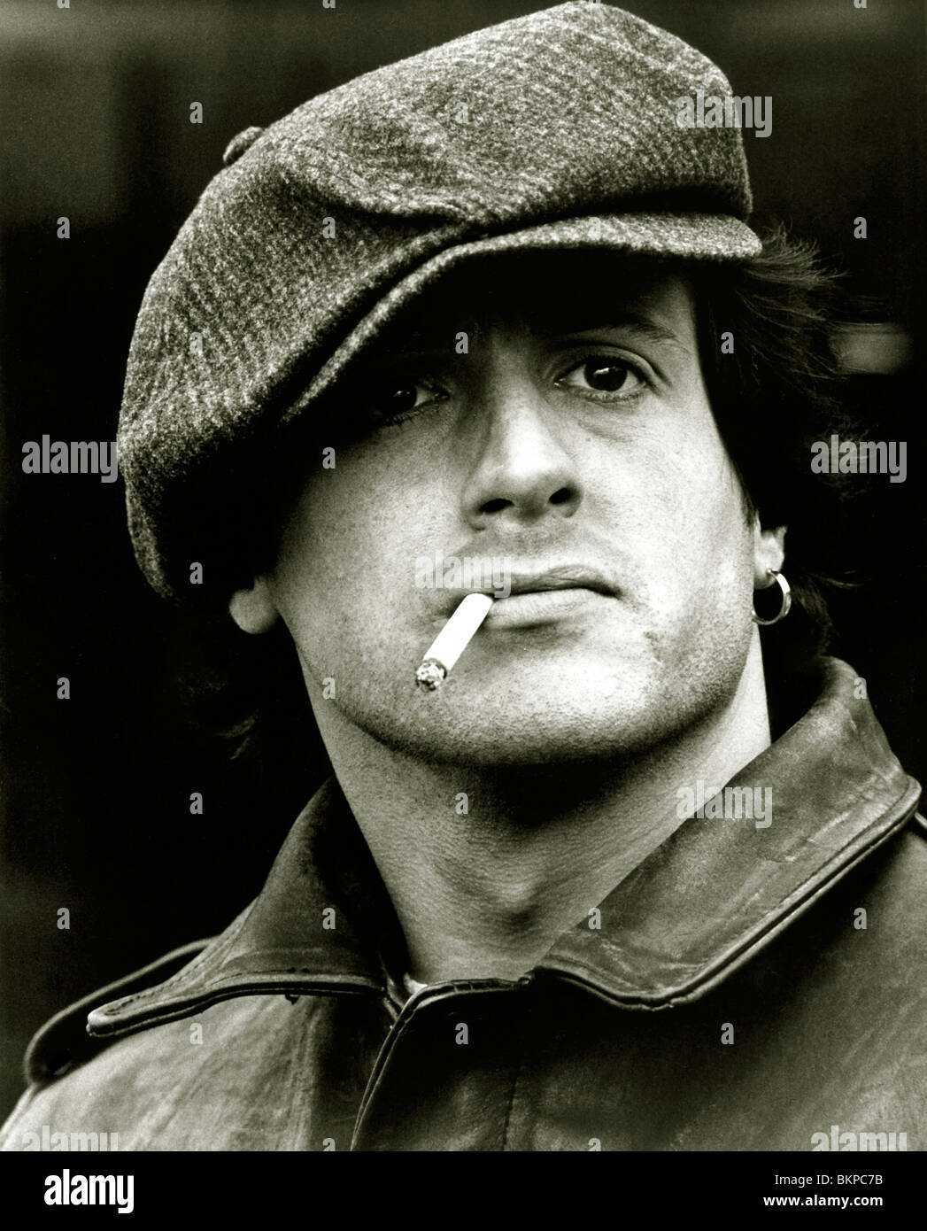 SYLVESTER STALLONE, FLAT CAP, SMOKING, PORTRAIT, EARRING, BOMBER JACKET Stock Photo
