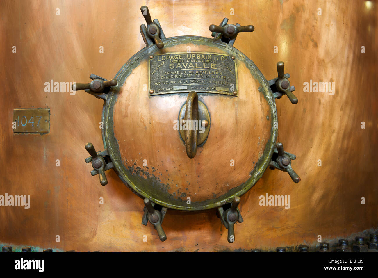 Close-up of the plaque of manufacture on a copper still in the Van Ryn distillery in Stellenbosch, South Africa. Stock Photo