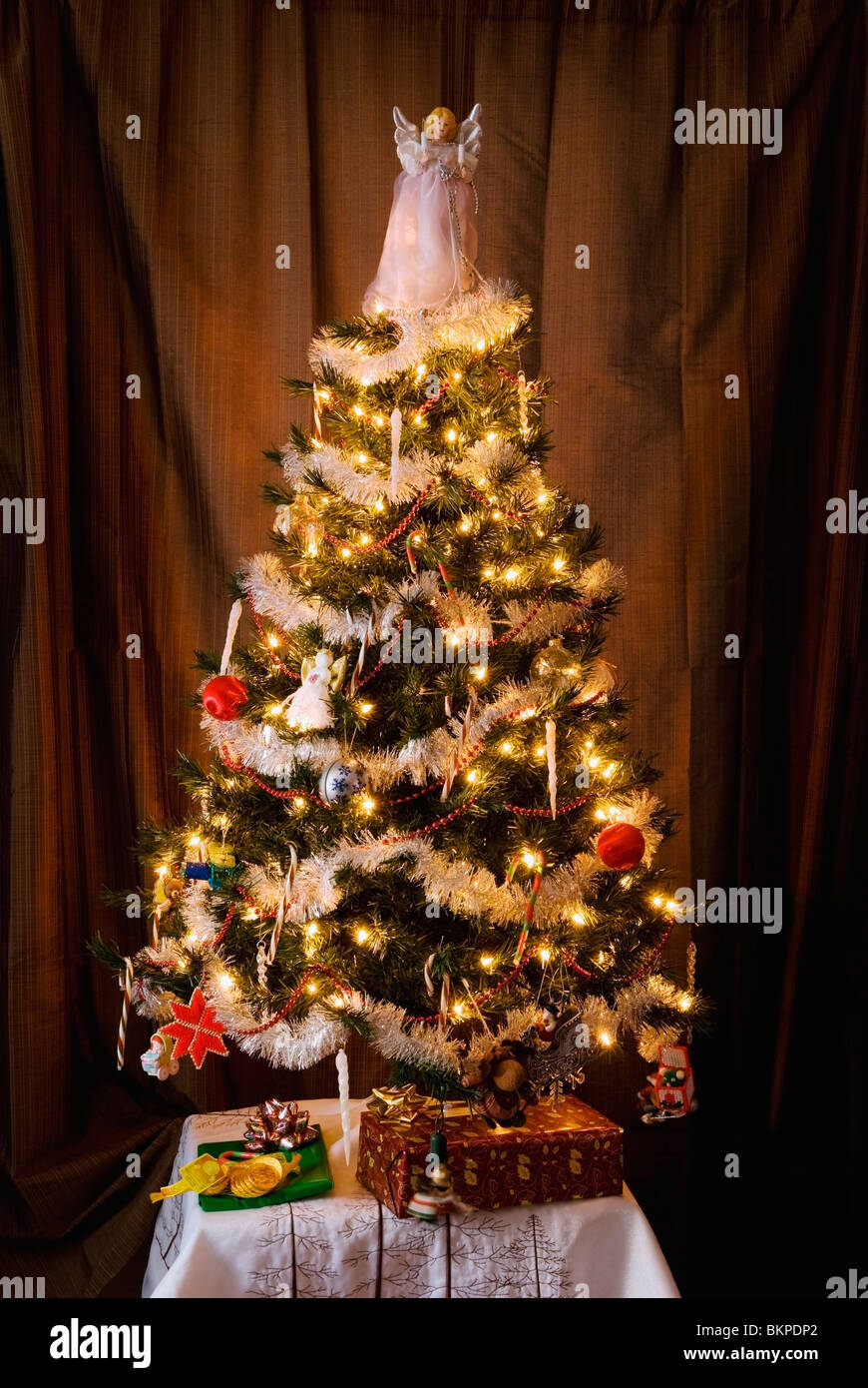 A Decorated Christmas Tree With An Angel On Top Stock Photo Alamy
