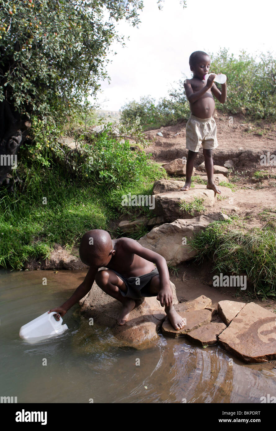 Lesotho: boy fetching water from a well Stock Photo