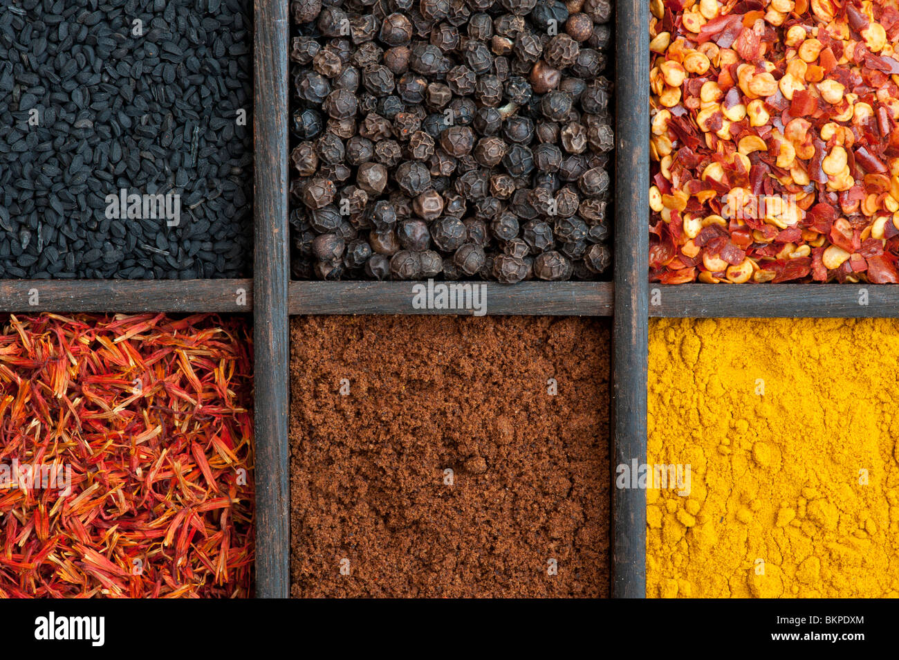 Indian spices in an old wooden tray Stock Photo Alamy
