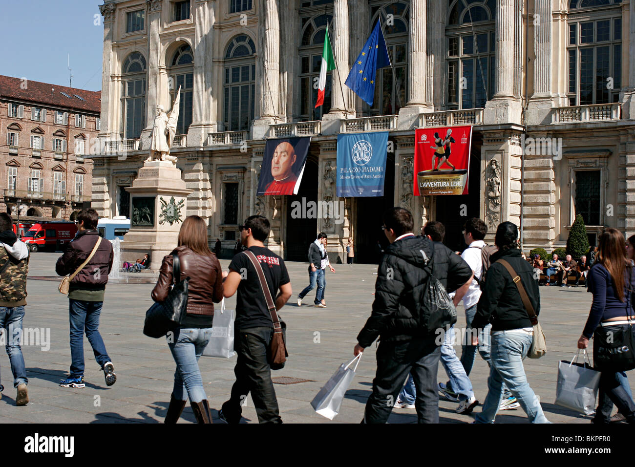 Tourists - Students walking in the Turin downtown. Piazza Castello. Stock Photo