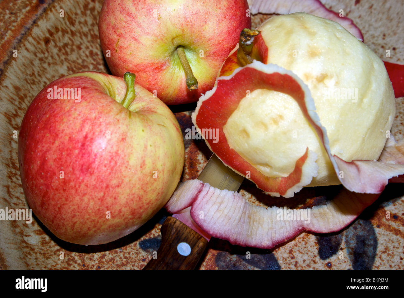 Peeled Gala apples in porcelain bowl for cooking Stock Photo Alamy