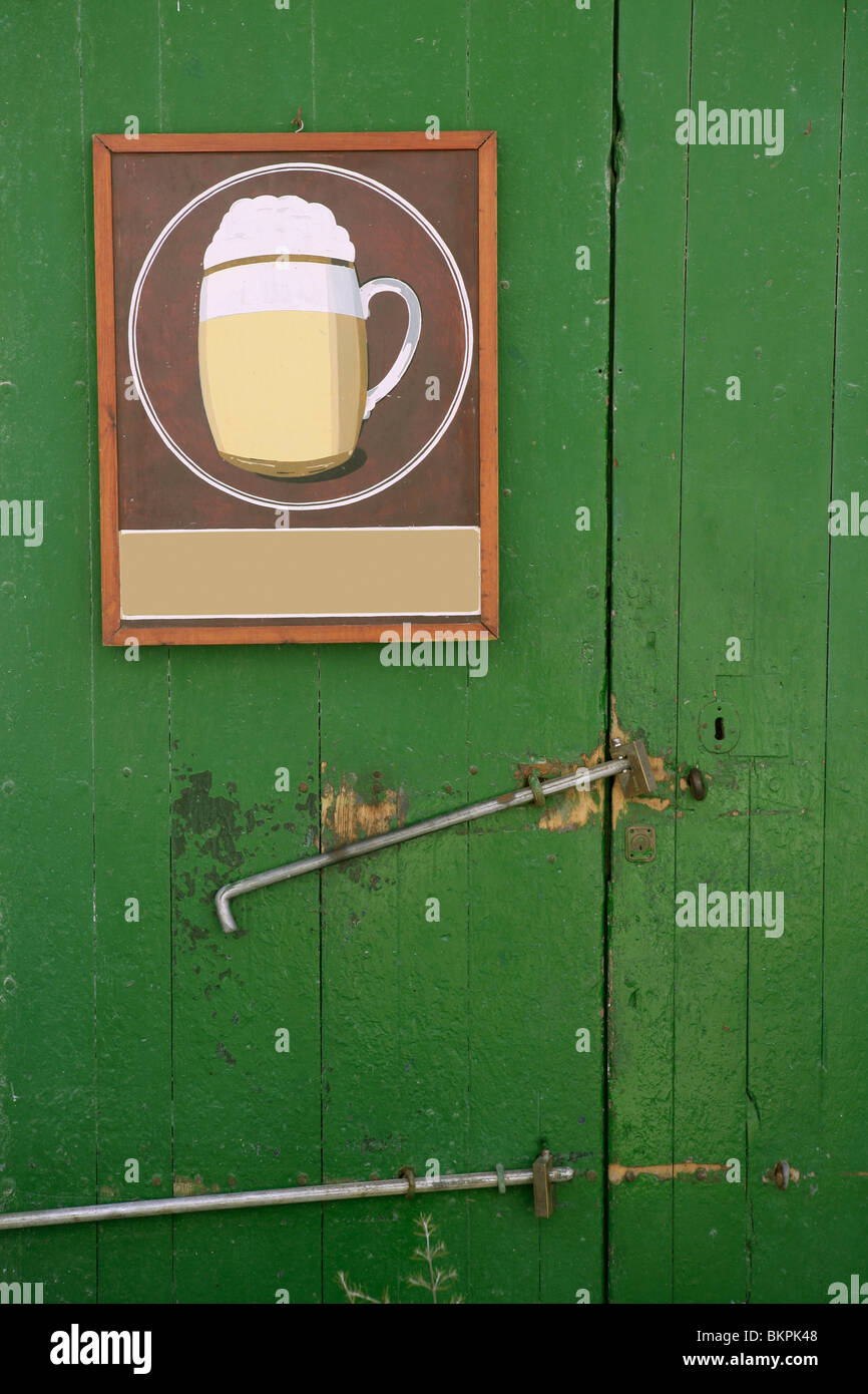 Beer Draw Hand Painted Poster In A Green Wooden Door Stock Photo