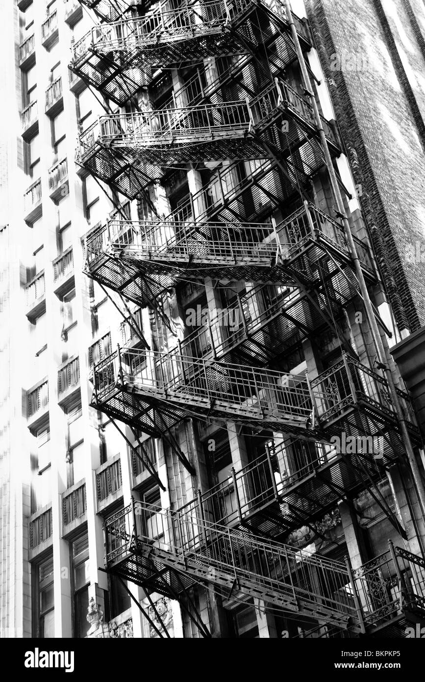FIRE ESCAPE ON THE SIDE OF THE OLD DOWNTOWN BUILDING ON ADAMS STREET IN CHICAGO, ILLINOIS, USA  Stock Photo