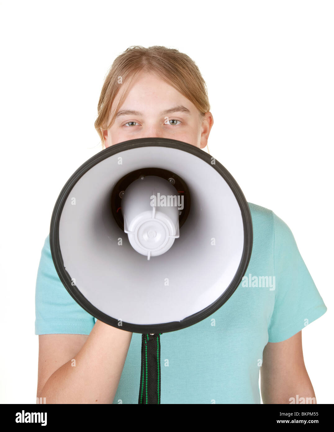 teenage girl talking in megaphone or bullhorn on white Stock Photo