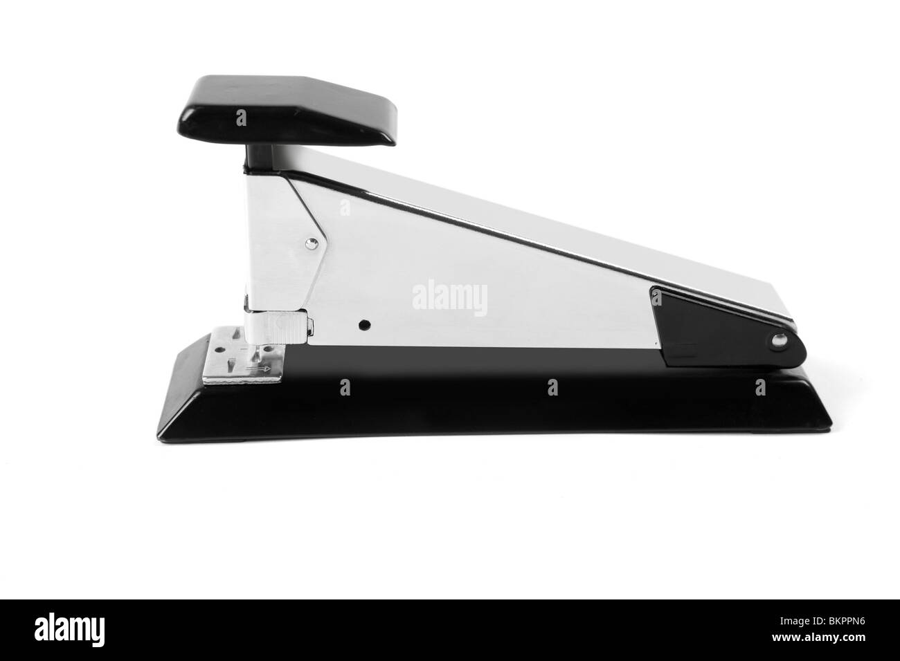 Stapler on stainless steel silver chrome and black over white Stock Photo