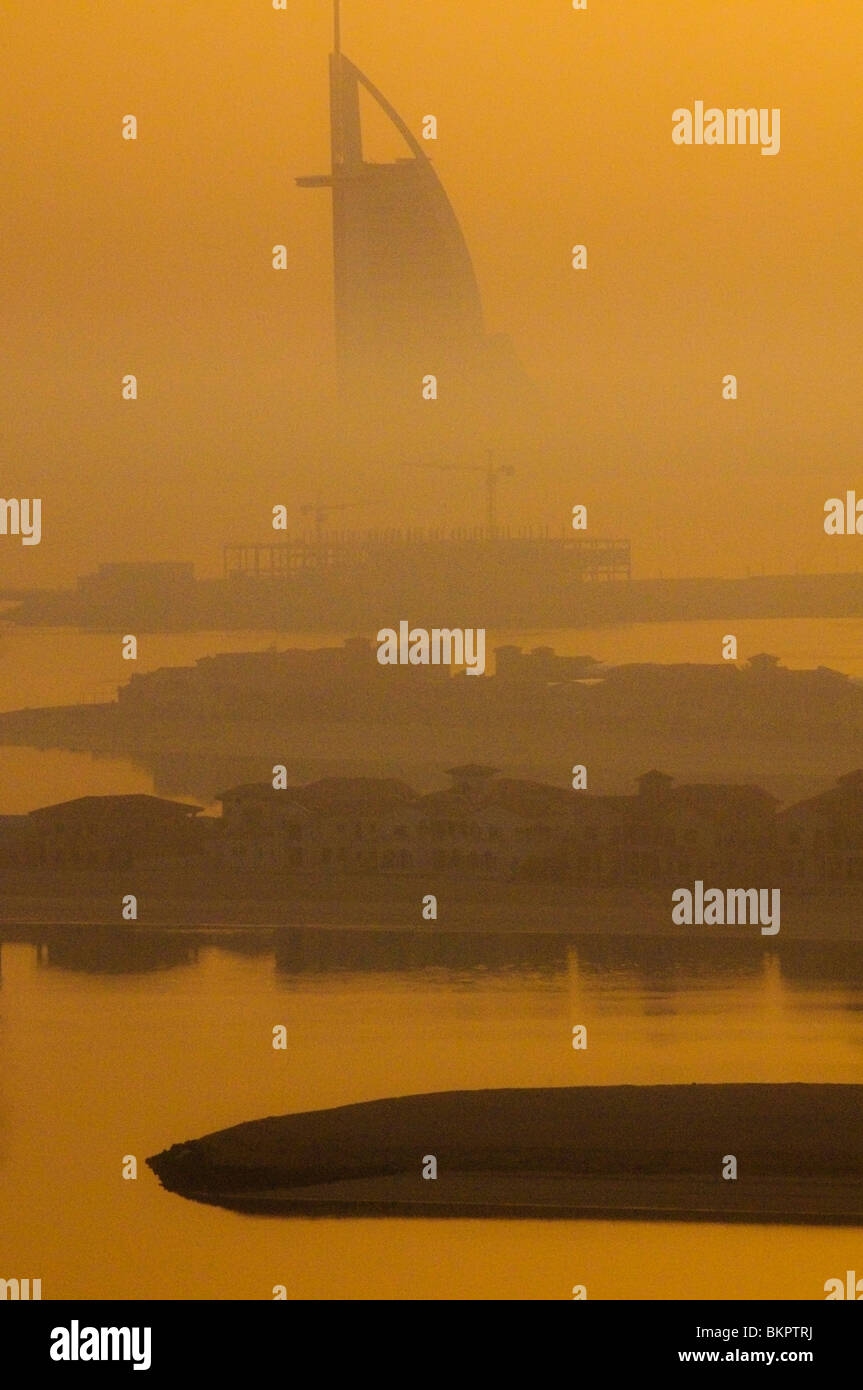 View in the morning fog of Palm Island and Burj Al Arab Hotel Dubai Stock Photo
