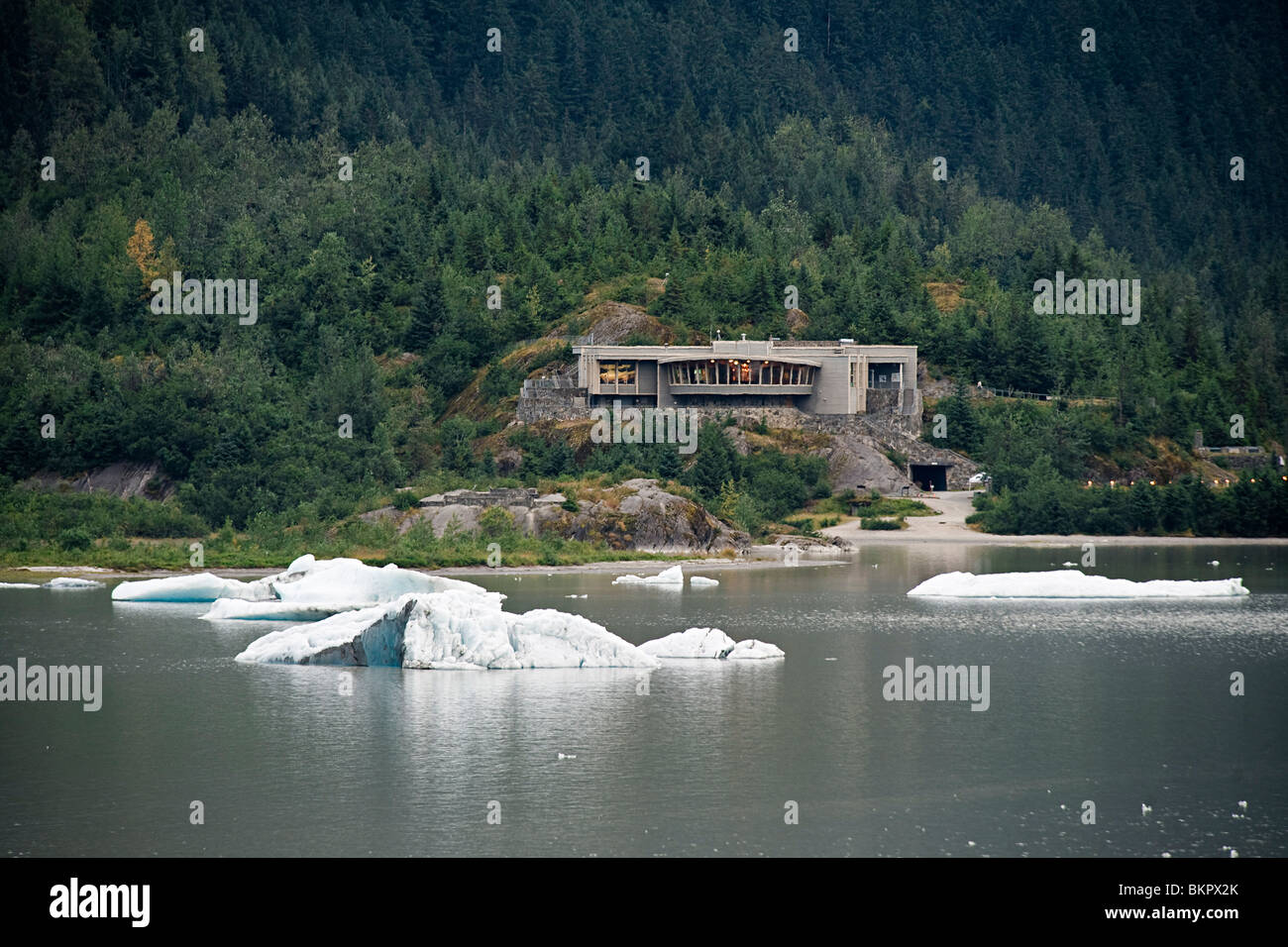 View of the Mendenhall Glacier Visitor Center with icebergs in Mendenhall Lake, Juneau, Alaska Stock Photo