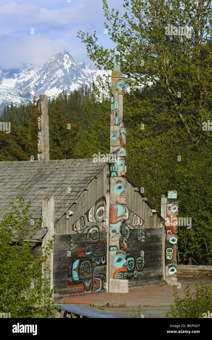 Tlingit tribal house at Fort Seward with Chilkoot Range in the background, Haines, Alaska Stock Photo