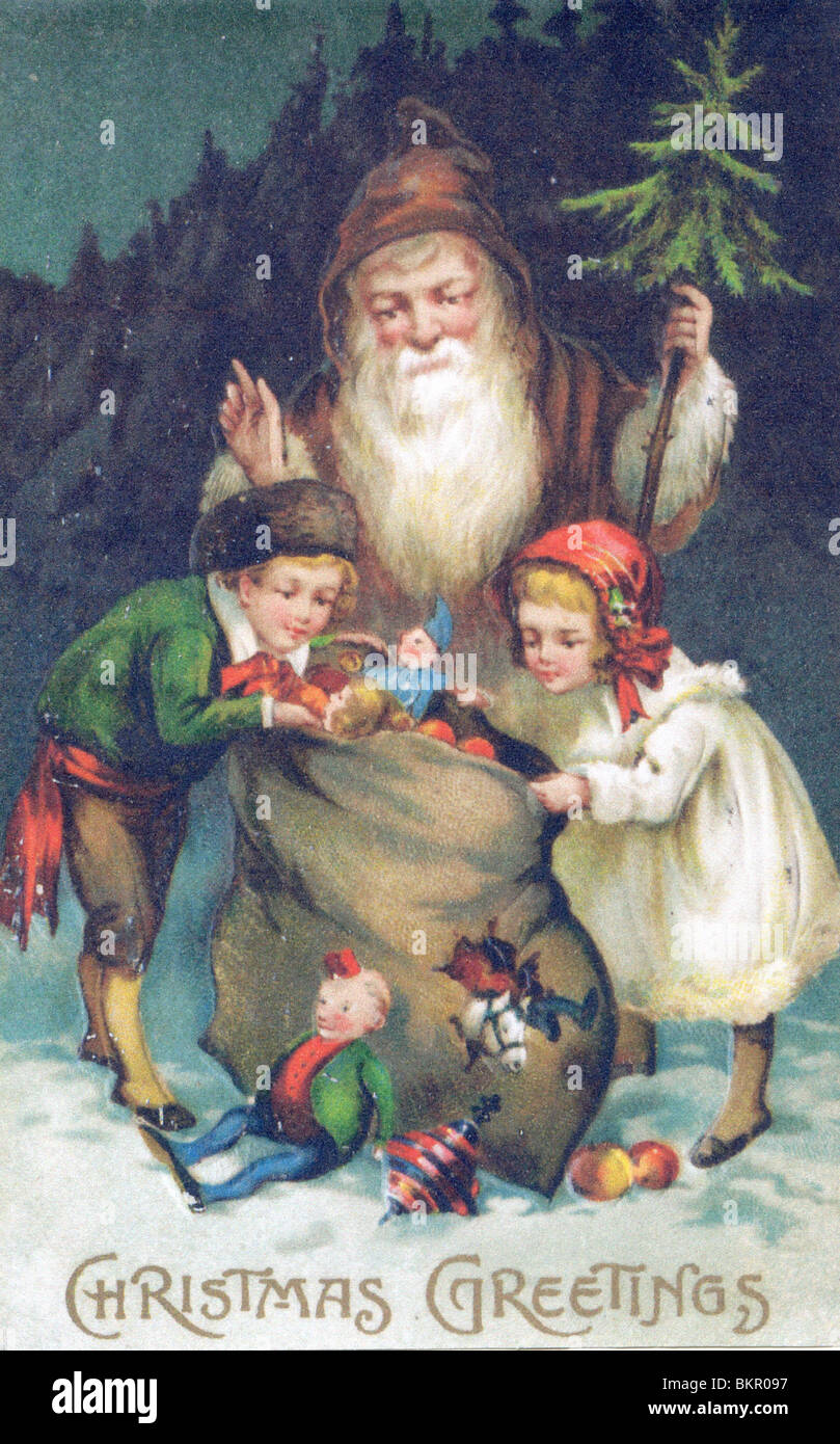 Father Christmas with Children looking in the Toy Sack Stock Photo