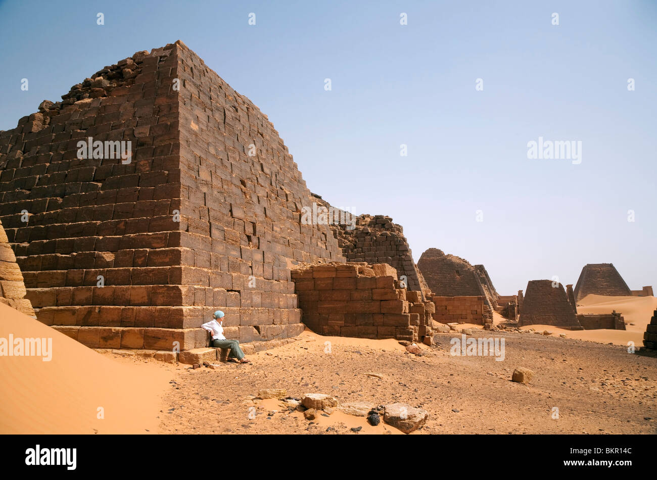 Sudan, Begrawiya. A tourist explores the ancient Nubian Pyramids. Stock Photo