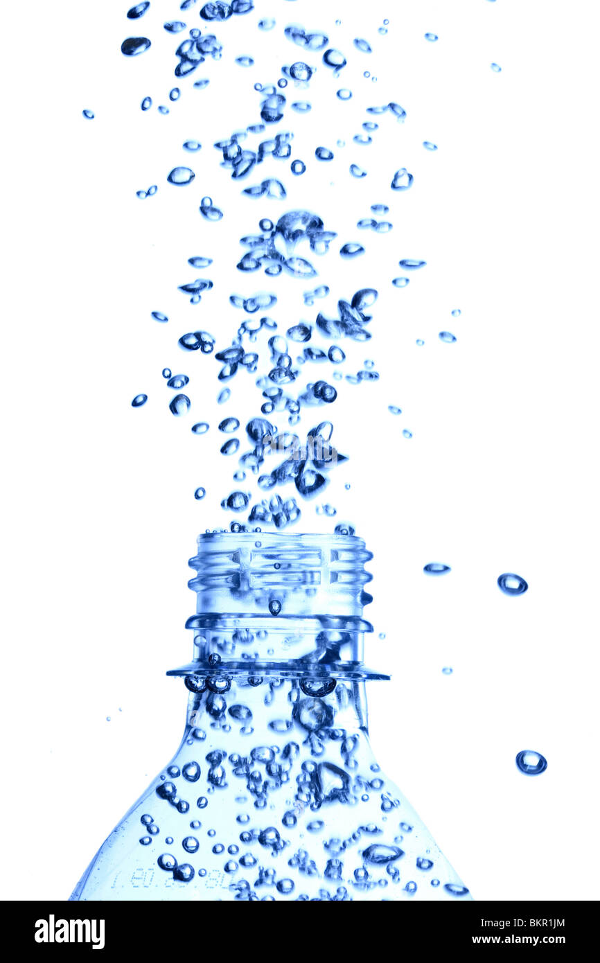 bottle in pure water with waves and bubbles Stock Photo
