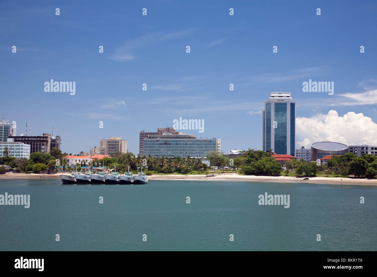 Tanzania, Dar es Salaam. Modern glass skyscrapers stand alongside older buildings on Dar es Salaam's coast. Stock Photo
