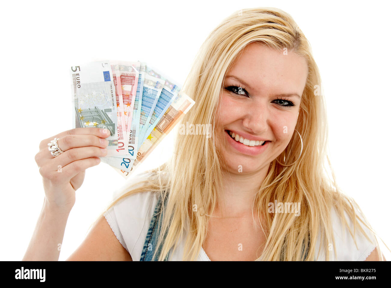 Young woman is holding euro money over white background Stock Photo - Alamy