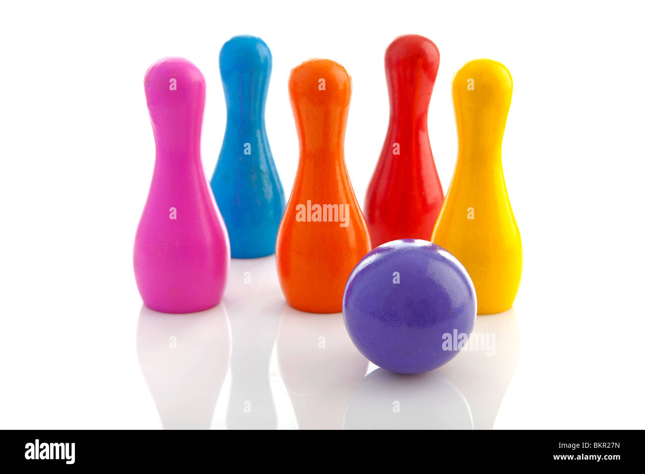 colorful bowling pins and ball isolated on white background Stock Photo