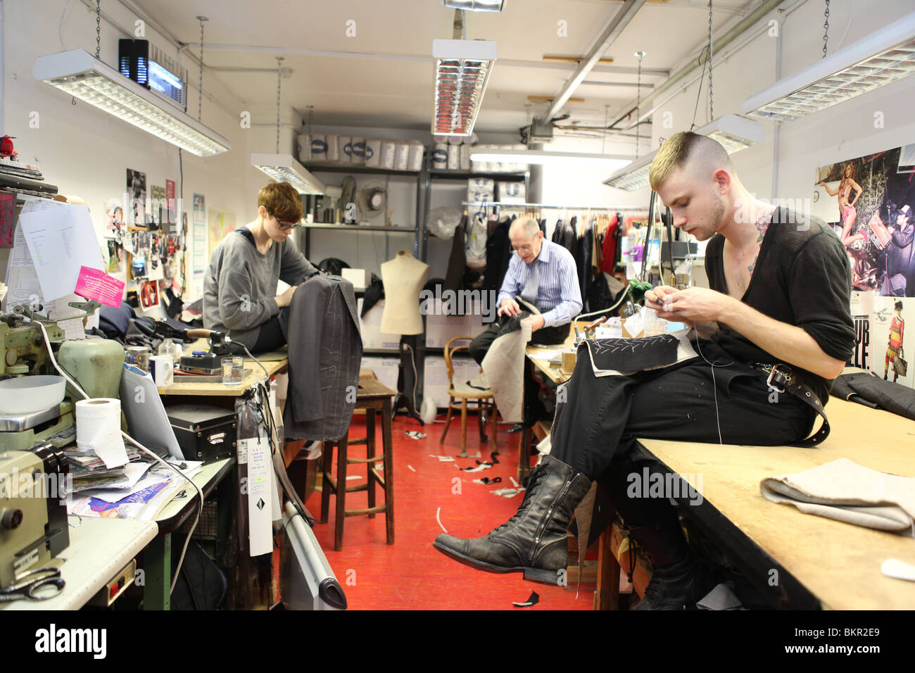 Tailors in the workshop of Henry Poole. Savile Row, London. Stock Photo