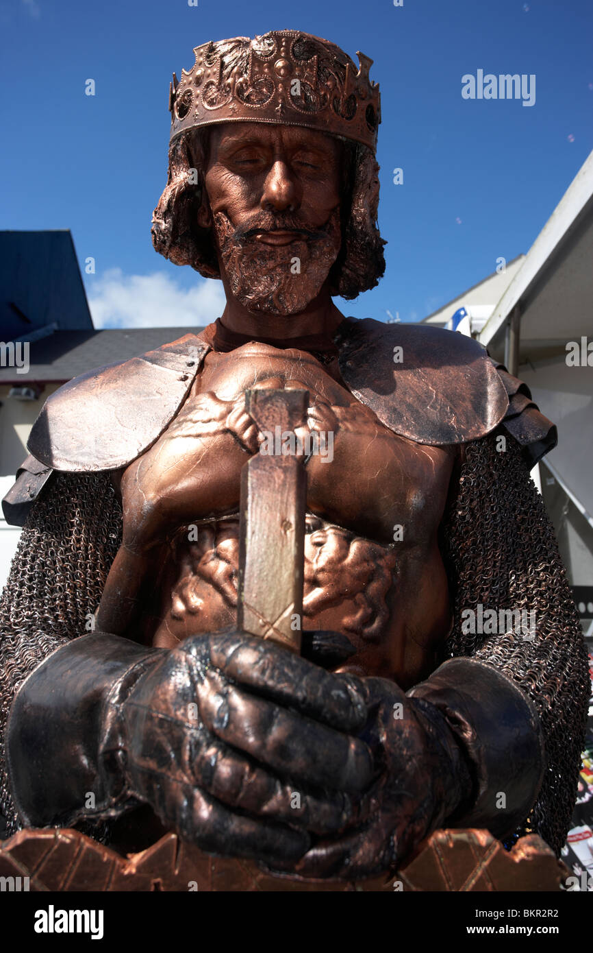 man dressed as a medieval knight bronze living statue Holywood County