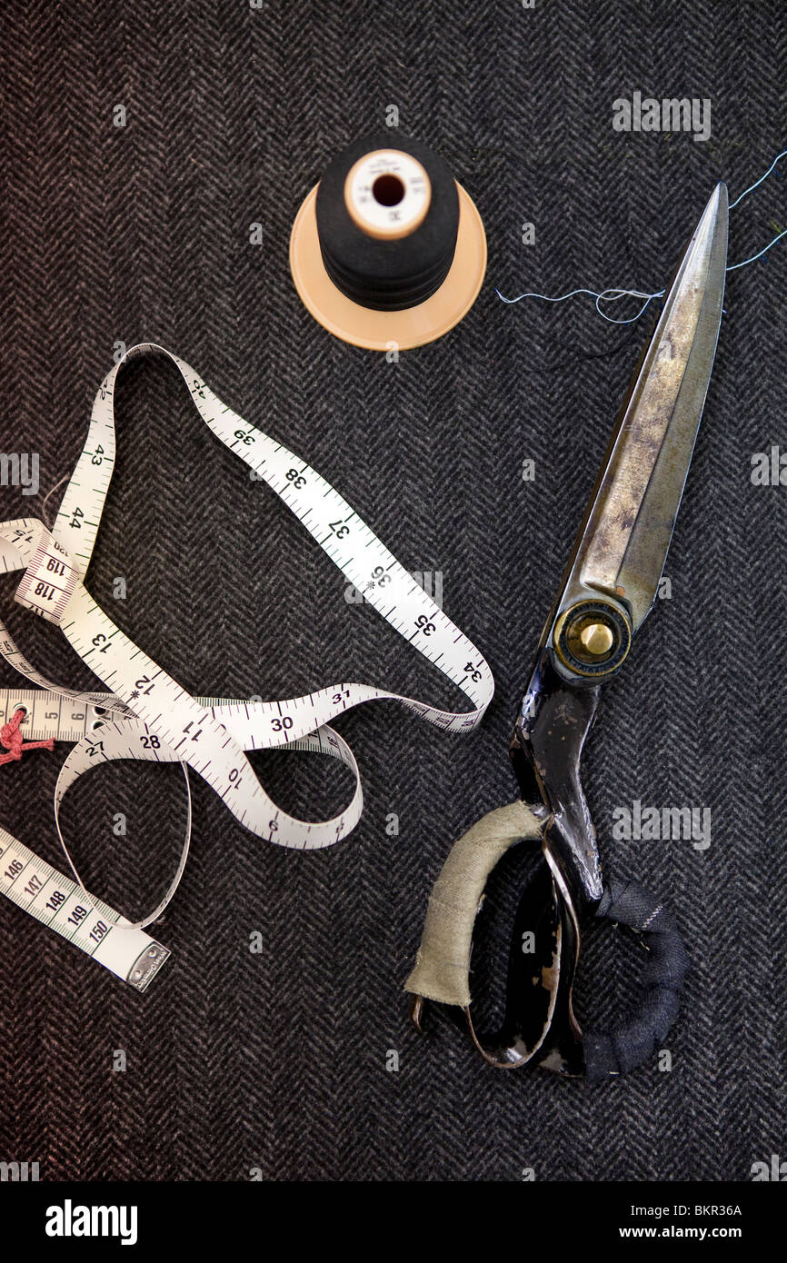 Tape, scissors and cotton. Savile Row tailors in London. Stock Photo
