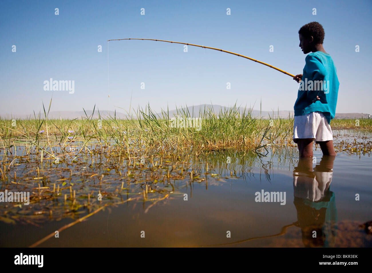 Ethiopia, Lake Awassa. A young boy fishes with a bamboo fishing rod Stock  Photo - Alamy