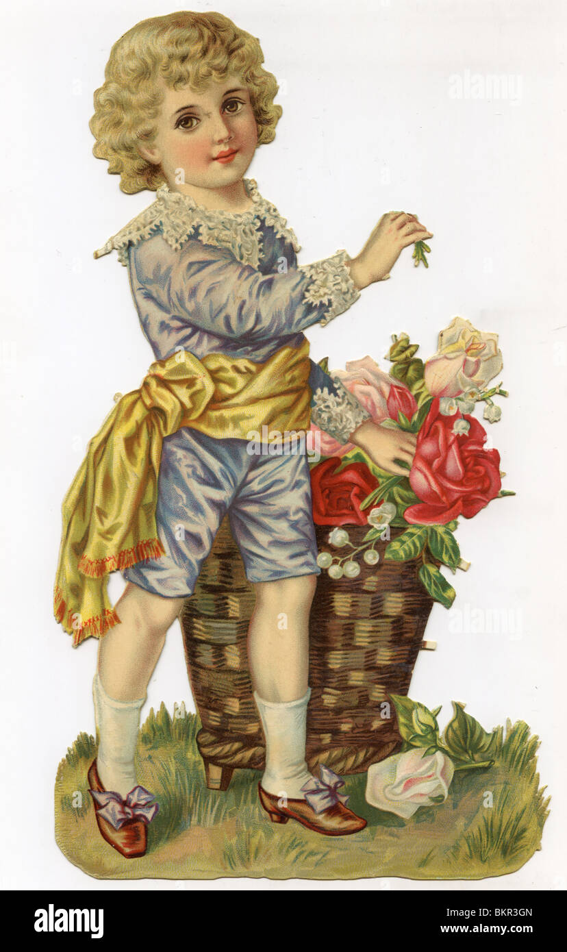 YOUNG BOY CARRIES A WICKER BASKET FULL OF FLOWERS Stock Photo